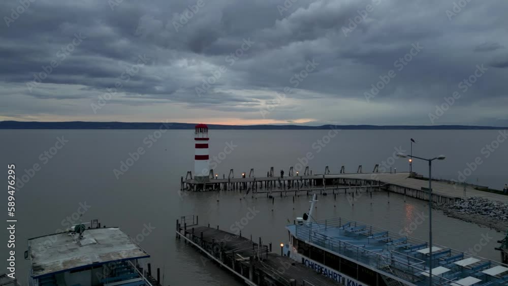 Beautiful cloudy sunset on the horizon of Podersdorf Lighthouse, Austria, 4k Beautiful cloudy sunset on the horizon of Podersdorf Lighthouse, Austria, 4k