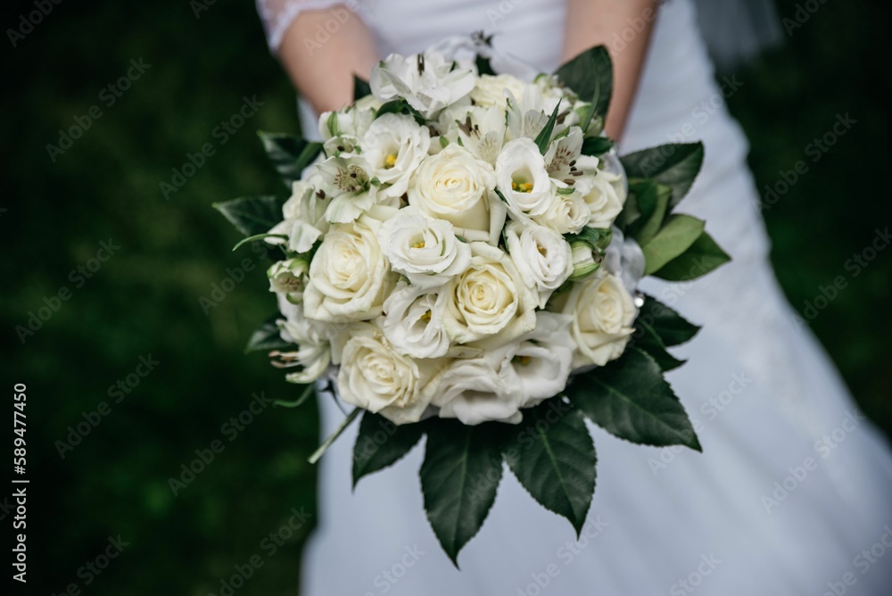 Closeup shot on the bride's bouquet in her hands Closeup shot on the bride's bouquet in her hands