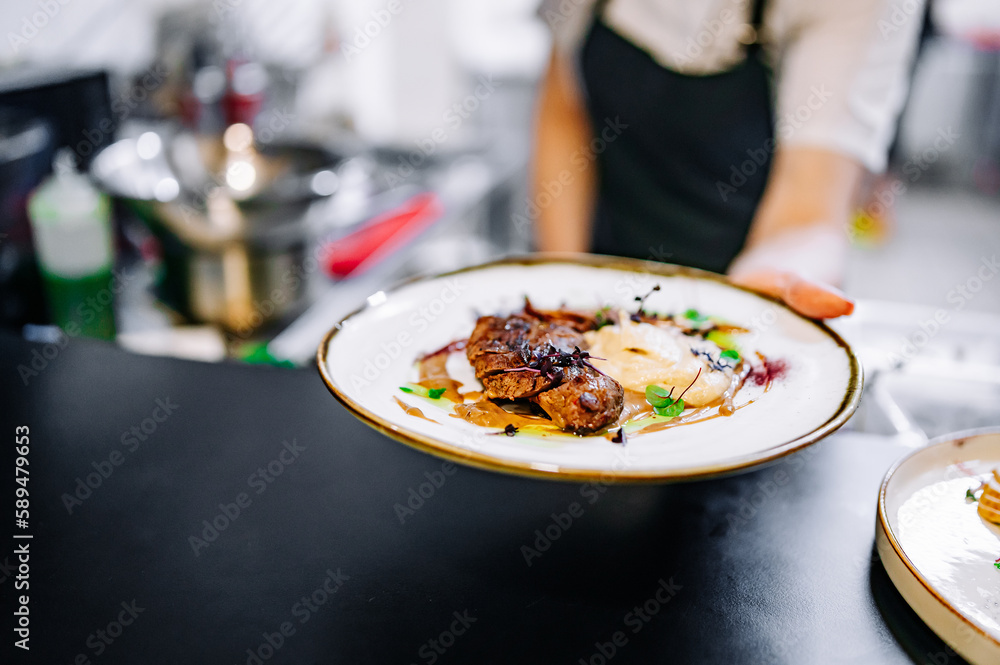 Chef cooking Roasted Duck breast fillets with vegetable pure on