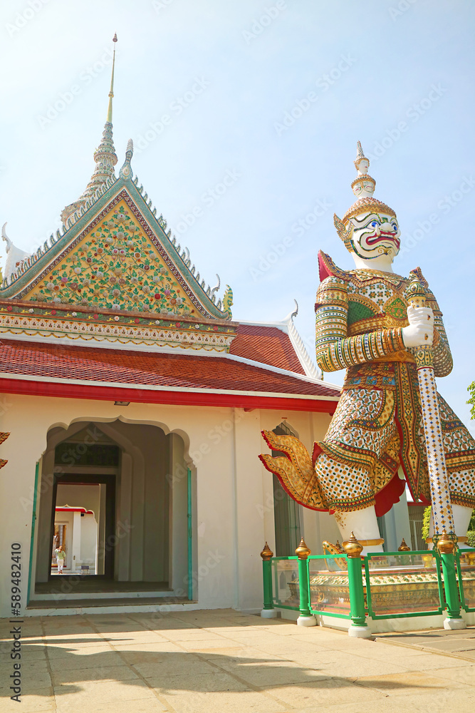Eastern Gate of The Temple of Dawn with the White Giant Sahatsadecha, One of Two Guardian Demons Statues, Bangkok, Thailand