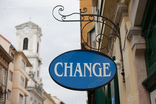 Currency exchange office vintage sign in historic town. Finance and business, money 