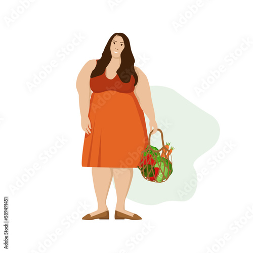 Happy smiling obese white woman in summer dress with fresh farm vegetables products in a bag on white background