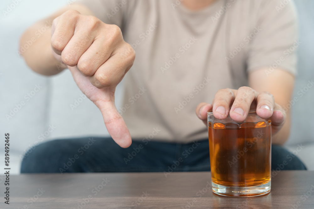 man refuses say no and avoid to drink an alcohol whiskey , stopping hand sign male, alcoholism treatment, alcohol addiction, quit booze, Stop Drinking Alcohol. Refuse Glass liquor, unhealthy, reject man refuses say no and avoid to drink an alcohol whiskey , stopping hand sign male, alcoholism treatment, alcohol addiction, quit booze, Stop Drinking Alcohol. Refuse Glass liquor, unhealthy, reject