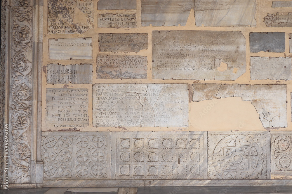 Santa Maria in Trastevere Church Portico Wall with Sculpted Stone Tablet Fragments in Rome, Italy