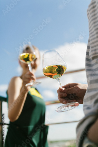 person with glass of wine