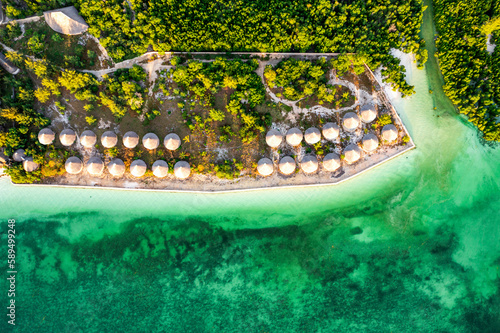 Overhead view of luxury tourist resort in front of the idyllic Indian Ocean, Pingwe, Chwaka Bay, Zanzibar, Tanzania photo