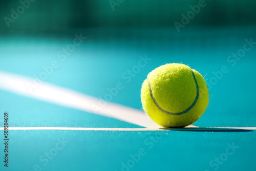 Tennis ball on the blue court 