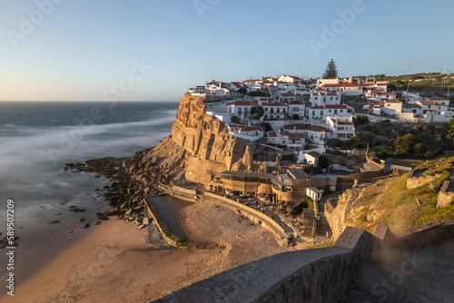 View of Azenhas do Mar, a small town along the Atlantic Ocean and Portuguese coastline at sunset, Portugal. photo