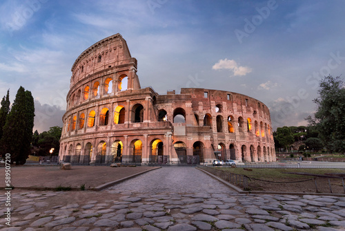 View of the Colosseum at sunset, a famous landmark from Roman Empire, Rome, Lazio, Italy. photo