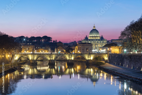 View of the Vatican City at sunset along the Tiber river in Rome downtown, Lazio, Italy.