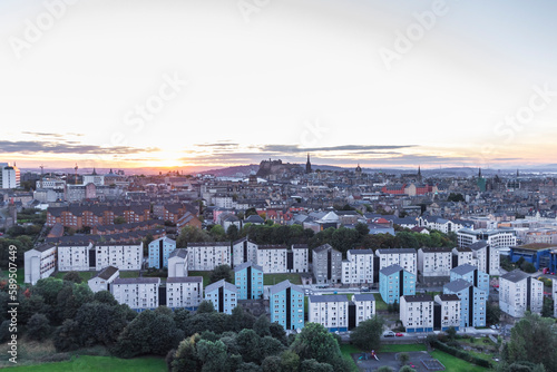 View of Edinburgh skyline at sunset from Arthur Seat and Holyrood Park, Scotland, United Kingdom. photo