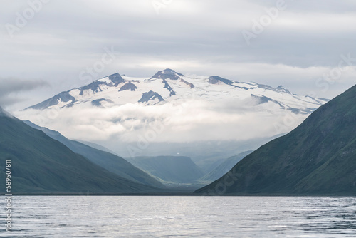 View of a snow-capped mountain overlooking the Unalaska Bay, Unalaska, Alaska, United States.