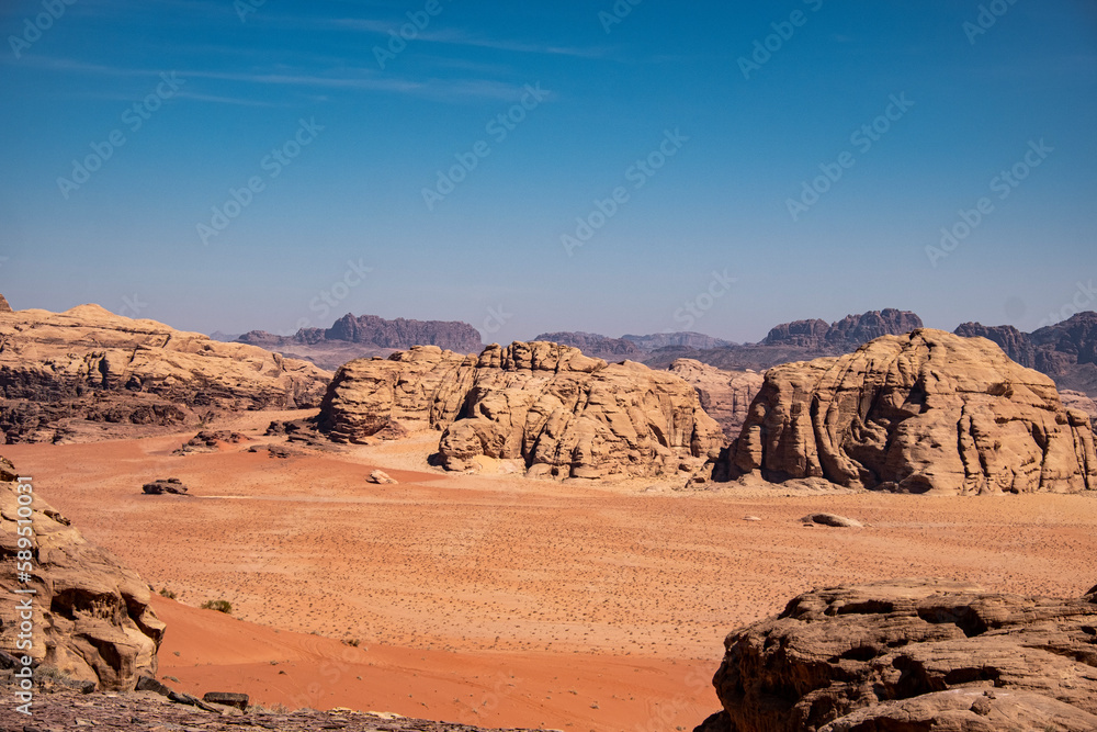 Red sand plain and some rocky mountains, Wadi Rum, Jordan, Middle East Red sand plain and some rocky mountains, Wadi Rum, Jordan, Middle East