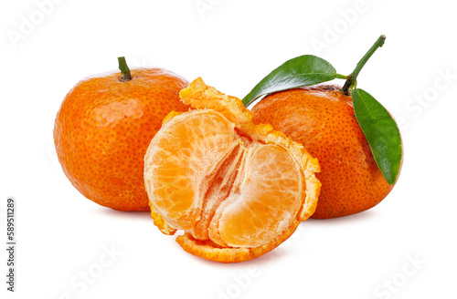 wholed and peeled small oranges with leaves on white background.