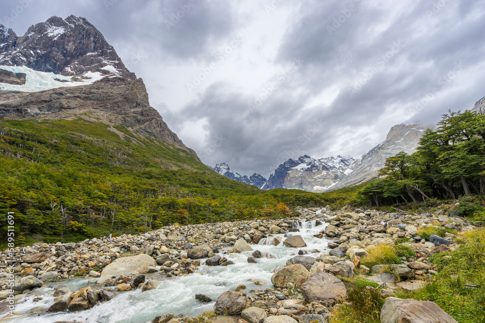 River flowing by Paine Grande mountain in French Valley, Torres del Paine National Park, Patagonia, Chile River flowing by Paine Grande mountain in French Valley, Torres del Paine National Park, Patagonia, Chile