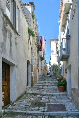 A narrow street among the old houses of Civitacampomarano, a historic town in the state of Molise in Italy. © Giambattista