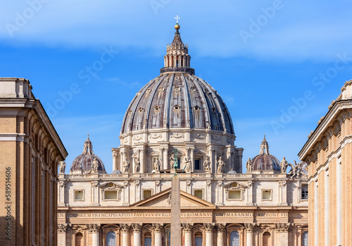 St. Peter's basilica dome and Egyptian obelisk on St. Peter's square in Vatican (translation "In honor of prince of Apostles; Paul V Borghese, Pope, in year 1612 and 7th year of his pontificate)
