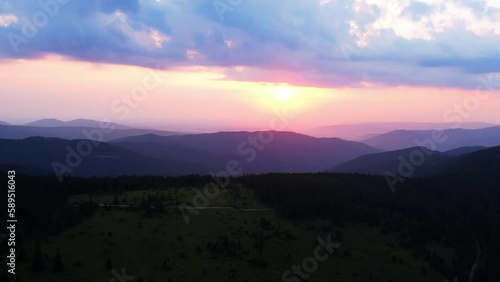 Wallpaper Mural Video footage of beautiful dramatic cloudy sky over grassy hills in mountains. Picturesque landscape of mountain hills under colorful evening sky with clouds and setting sun. Beauty of nature concept. Torontodigital.ca