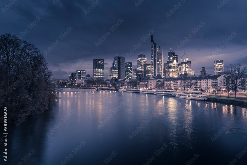 View from Main River to the skyline of city at dawn, Frankfurt am Main, Hesse, Germany View from Main River to the skyline of city at dawn, Frankfurt am Main, Hesse, Germany