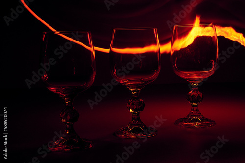 glass of wine with fire line on background