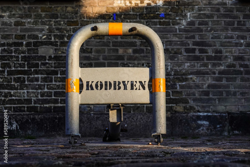 Photography Copenhagen, Denmark  A small sign in a parking lot says reserved for Kodbyen, or Meat Market, refering to the area known as the Meatpacking District