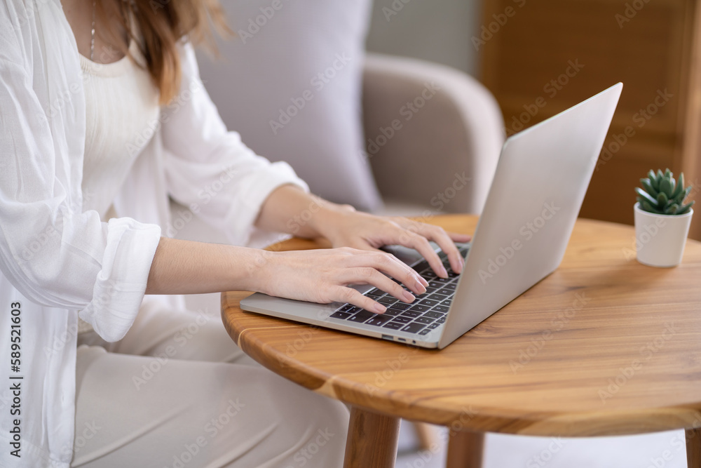Business woman working from home. work online on laptop. Asian businesswoman working on sofa online business with social distancing laptop online meeting. Business woman working from home. work online on laptop. Asian businesswoman working on sofa online business with social distancing laptop online meeting.