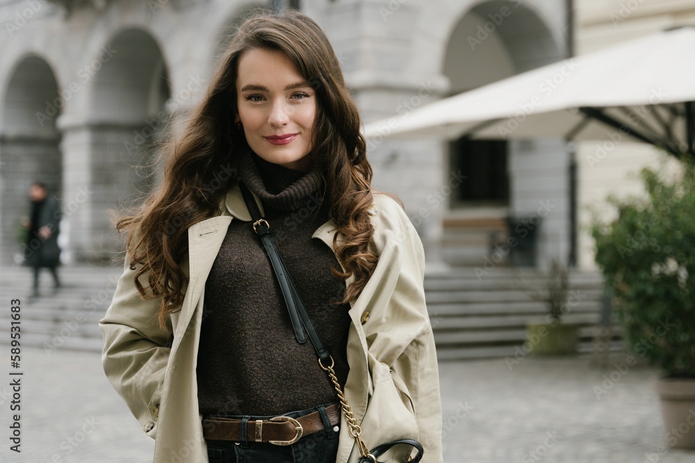 Fototapeta premium Young beatiful woman portrait in the historical city centre of Ljubljana in trendy outfit
