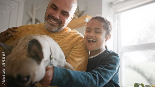 Family and boy with Down syndrome giving dog treats