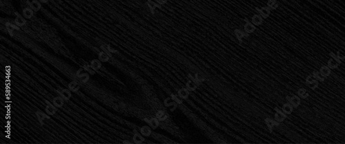 Dark black wood table background, lots of contrast, wooden texture, Black paper house on red wood background, real estate concept, black wood background wooden gray pattern old wall top nature.