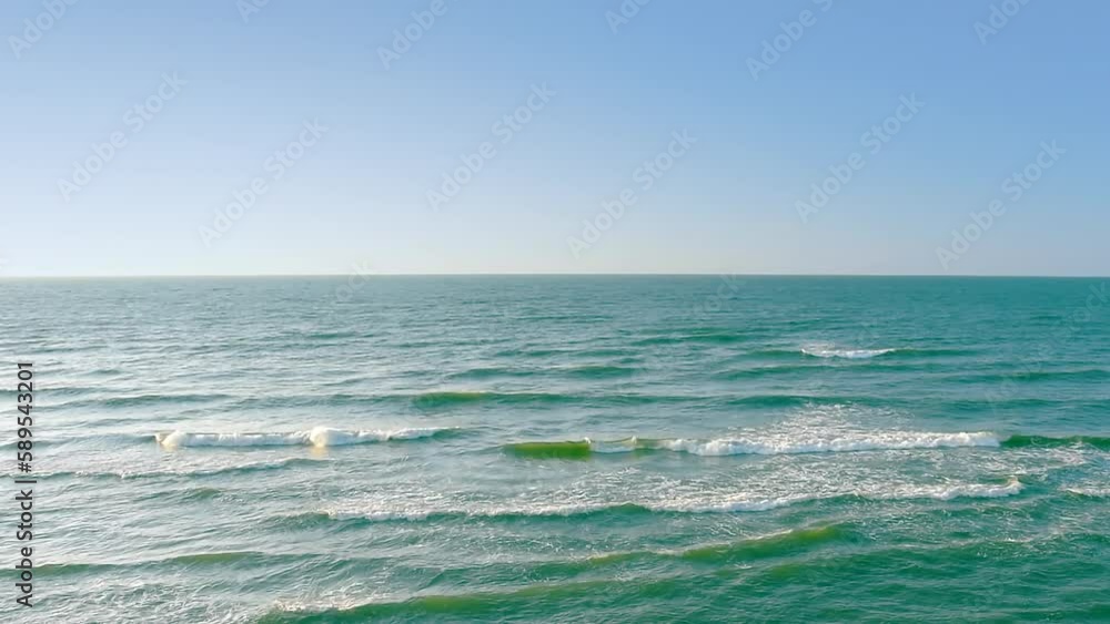 Beautiful sea waves on the blue sky background, view of panorama coast sea by the beach with turquoise waves, horizon, real time, hd. ProRes 422 HQ. Beautiful sea waves on the blue sky background, view of panorama coast sea by the beach with turquoise waves, horizon, real time, hd. ProRes 422 HQ.