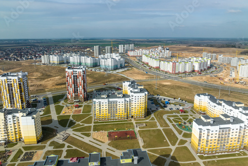 aerial panoramic view over construction of new modern residential complex with high-rise buildings in town