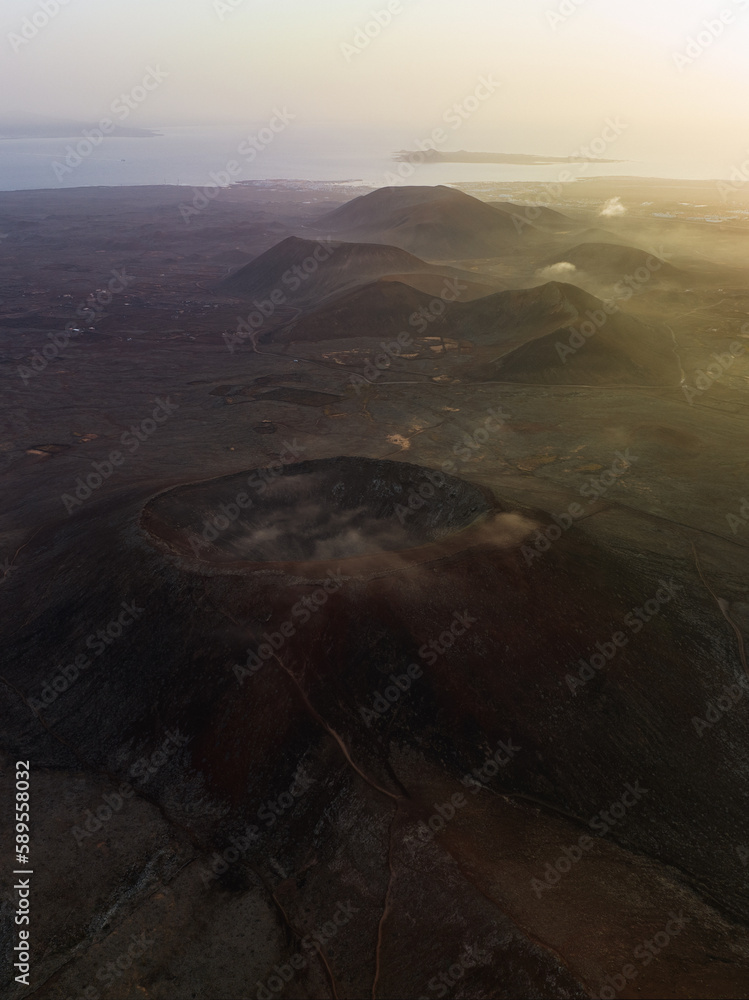 View from above, stunning aerial view of Calderon Hondo during a beautiful sunrise. Calderon Hondo is a volcanic caldera in the sland of Fuerteventura, Canary Islands.