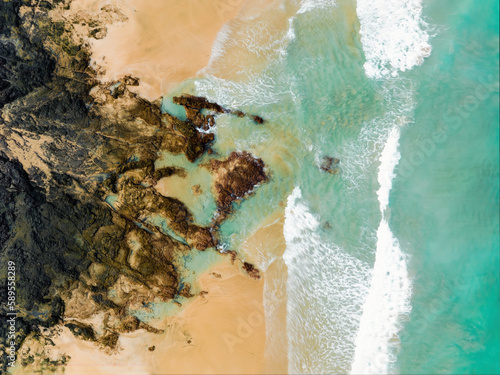 Obraz na płótnie View from above, stunning aerial view of a beautiful beach bathed by a turquoise water. Cofete Beach (Playa de Cofete) Fuerteventura, Canary Islands, Spain. w salonie