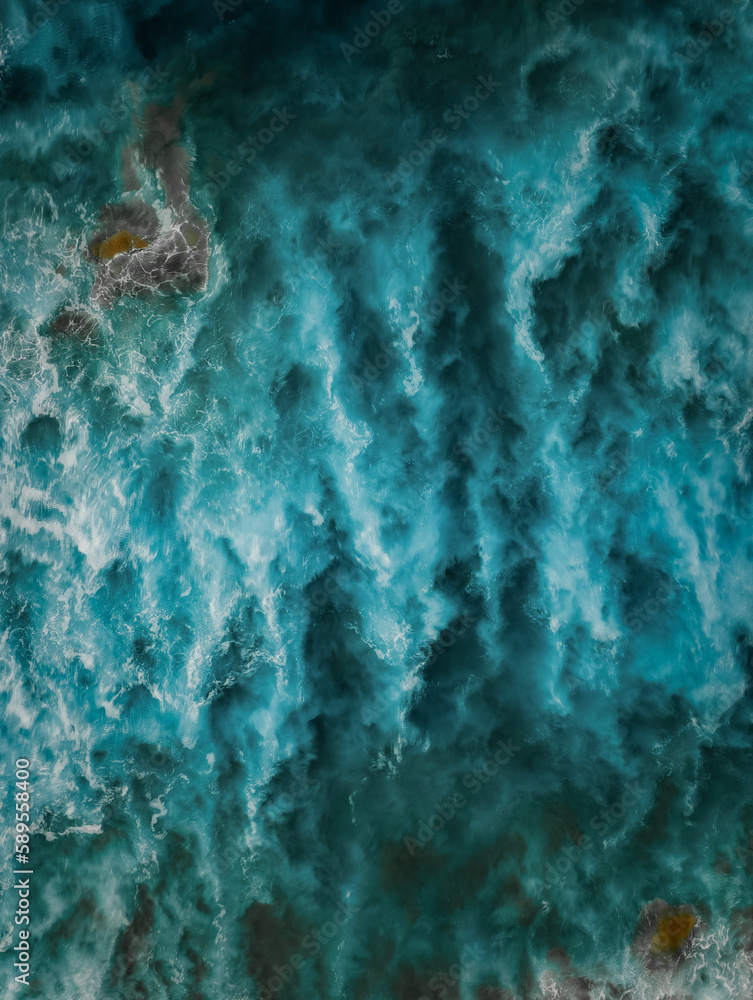 View from above, stunning aerial view of a Of a beautiful blue sea that forms a natural background.