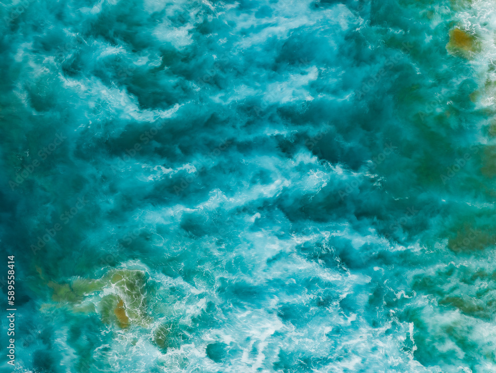 View from above, stunning aerial view of a Of a beautiful blue sea that forms a natural background.