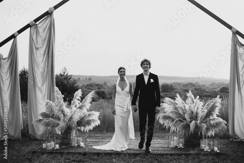 Bride and groom on their wedding ceremony photo