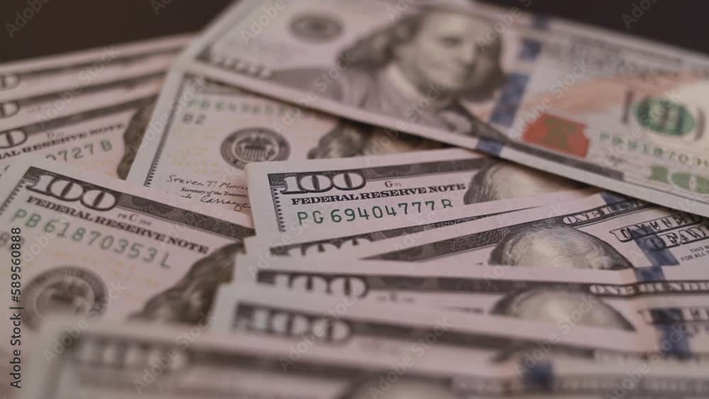 close-up of male hands counting a stack of hundred-dollar US banknotes. a businessman is counting cash. the concept of investment, money exchange, bribes or corruption. close-up of male hands counting a stack of hundred-dollar US banknotes. a businessman is counting cash. the concept of investment, money exchange, bribes or corruption.
