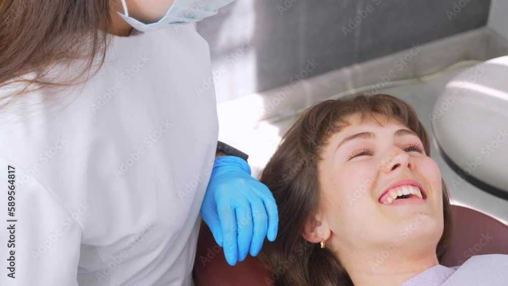 Dentist injects anesthetic syringe diseased teeth for patient to white