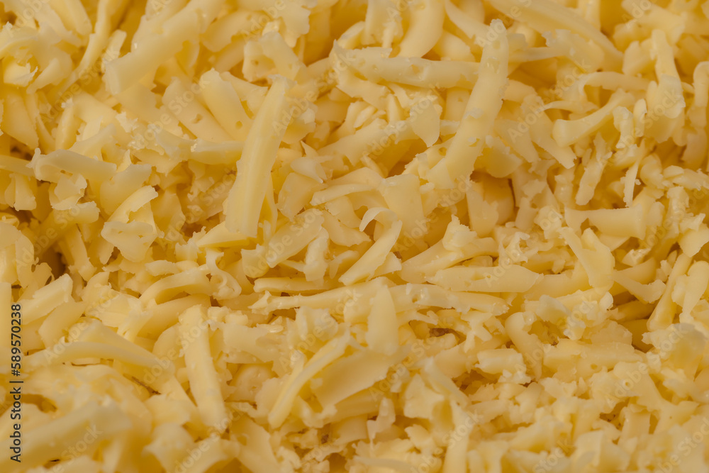 Hard cheese with holes grated into thin small slices Hard cheese with holes grated into thin small slices