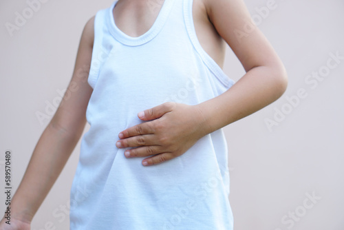 Wallpaper Mural Asian boys have stomach pains from not eating at the right time. Torontodigital.ca