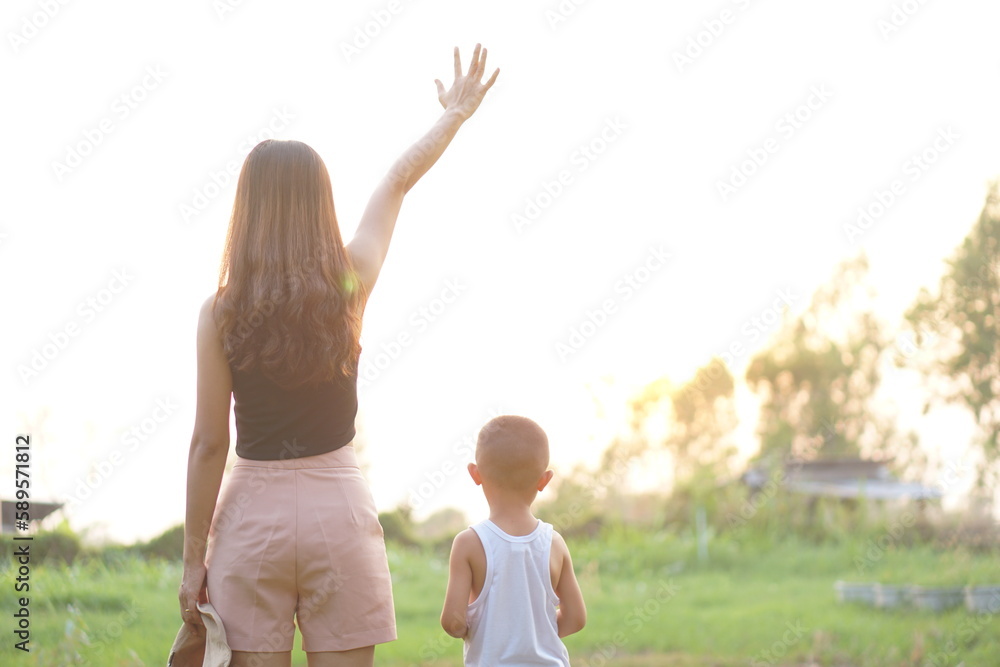 Fototapeta premium mother and son watching the sunset