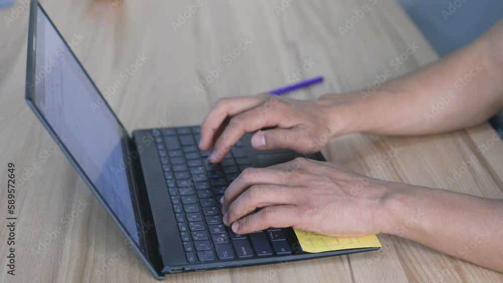 Hands of a worker typing on notebook keyboard. Technology concept Hands of a worker typing on notebook keyboard. Technology concept