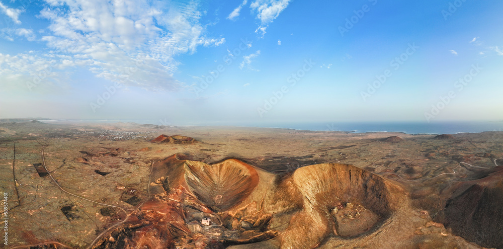 View from above, stunning panoramic view of Calderon Hondo during a beautiful sunrise. Calderon Hondo is a volcanic caldera in the sland of Fuerteventura, Canary Islands.