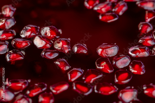 Grains of red ripe pomegranate close up
