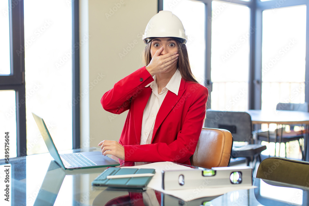 covering mouth with a hand and shocked or surprised expression. architect concept covering mouth with a hand and shocked or surprised expression. architect concept
