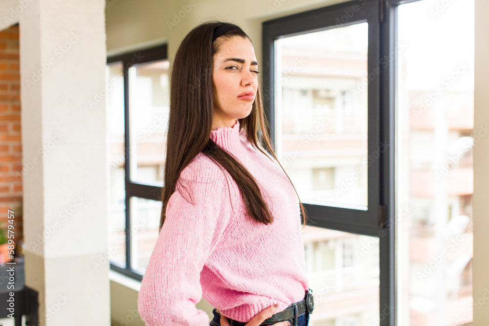 pretty caucasian woman looking proud, confident, cool, cheeky and arrogant, feeling successful pretty caucasian woman looking proud, confident, cool, cheeky and arrogant, feeling successful