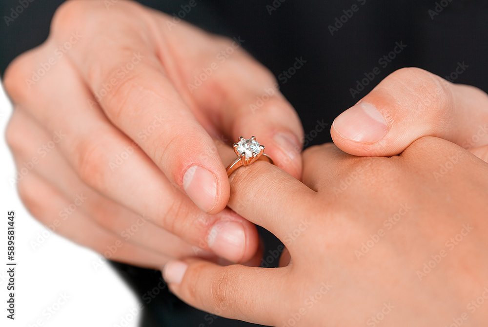 Close up Groom Putting the Wedding Ring on bride Close up Groom Putting the Wedding Ring on bride