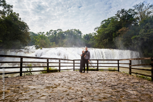 Tourists couple in Agua Azul park in Palenque Mexico