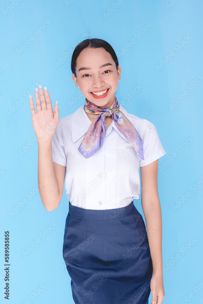 A flight attendant greeting the passengers. a stewardess saying hello. One hand. A flight attendant greeting the passengers. a stewardess saying hello. One hand.