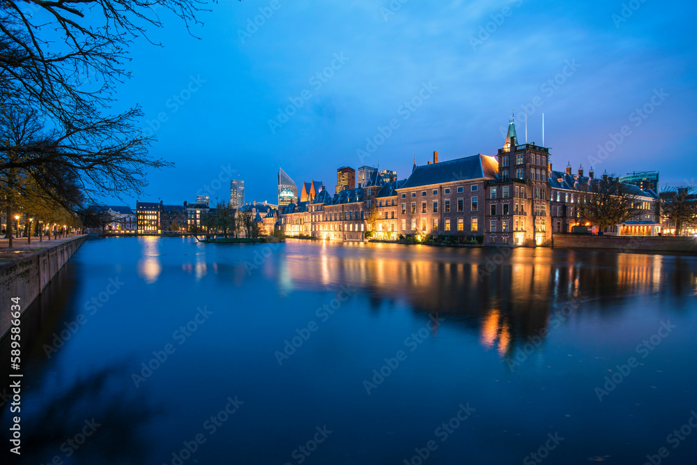 Hofvijver or Buitenhof, the dutch government headquarter with the skyline of the Hague at night